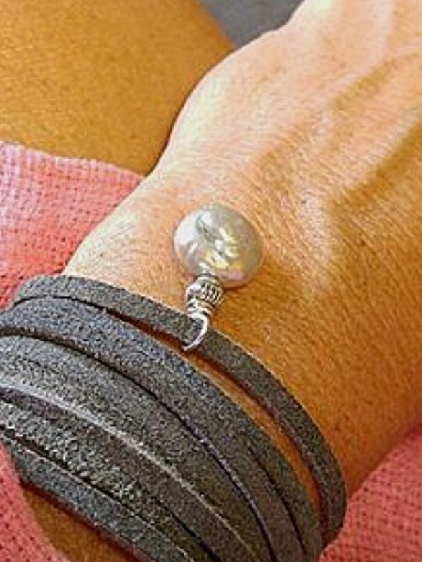 gray suede pearl bracelet on wrist
